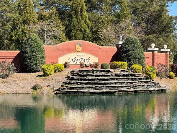 a view of a lake with a house in the background