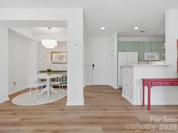 a view of kitchen with furniture and wooden floor