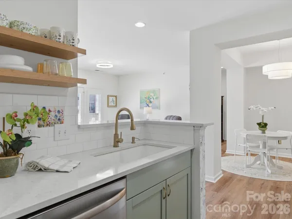 a kitchen with a sink and a refrigerator