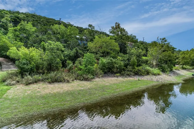 a view of a lake with a building in the background