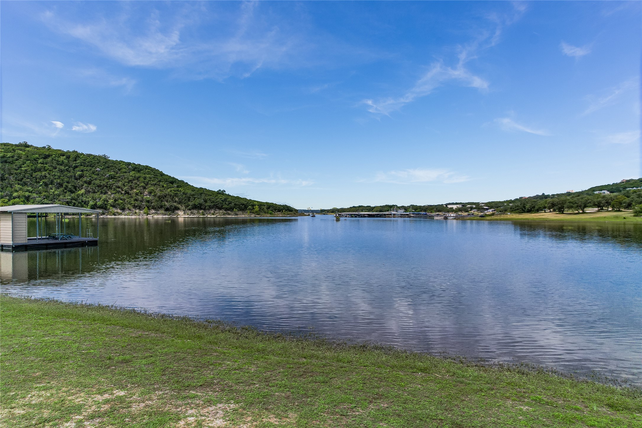13527 Bullick Hollow Road Austin, TX 78726 - Photo 9 of 11 a view of a lake with houses in the background
