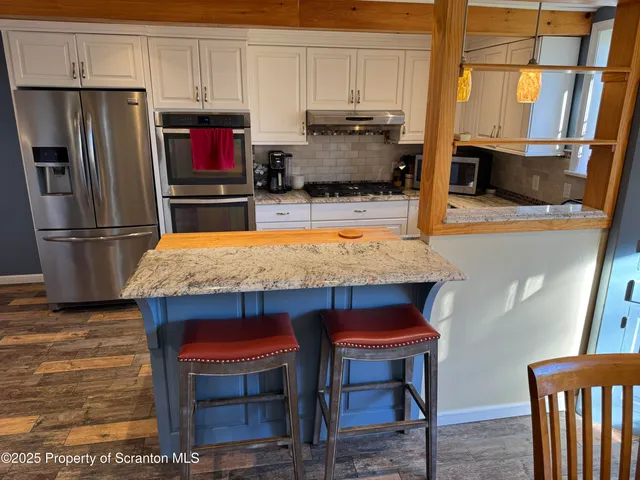 a view of a workspace with furniture