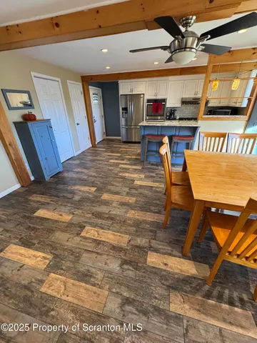 a living room with furniture rug and window