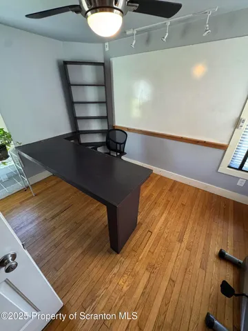 a view of a hardwood floor in a room