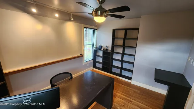 a room with stairs and wooden floor