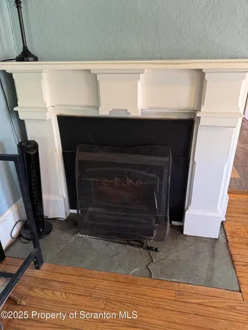 a view of staircase with white walls and a window