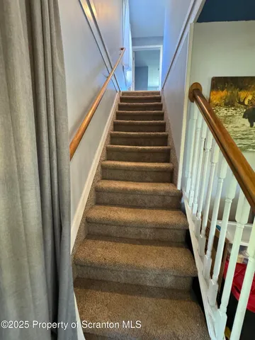 a swimming pool view with a outdoor seating