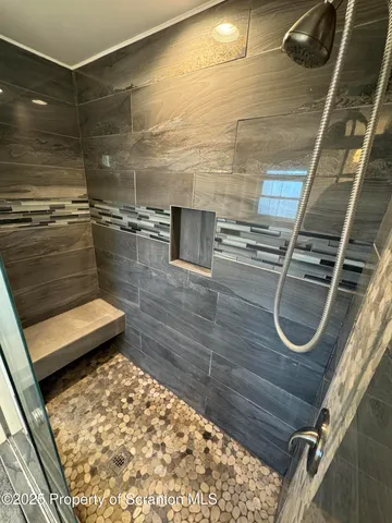 a bathroom with a toilet a sink and a window