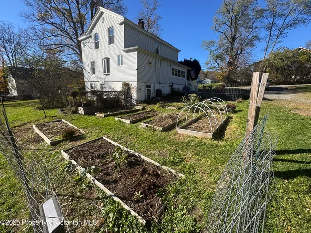 a view of a back yard of the house