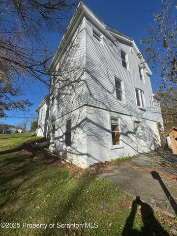a bench is sitting in middle of a yard