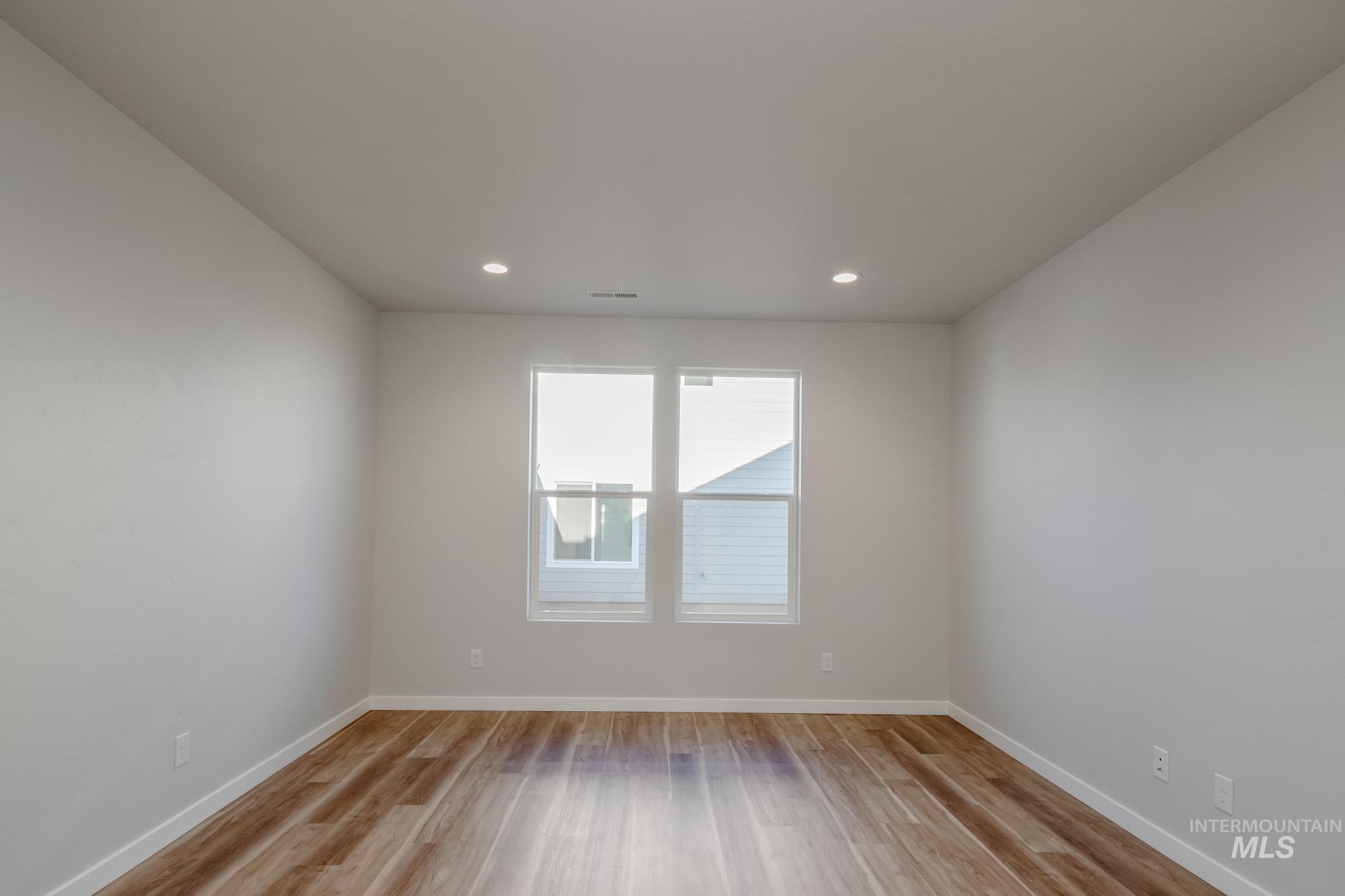 3170 South Maple Rnch Way Nampa, ID 83686 - Photo 19 of 32 Unfurnished room featuring light wood finished floors and recessed lighting
