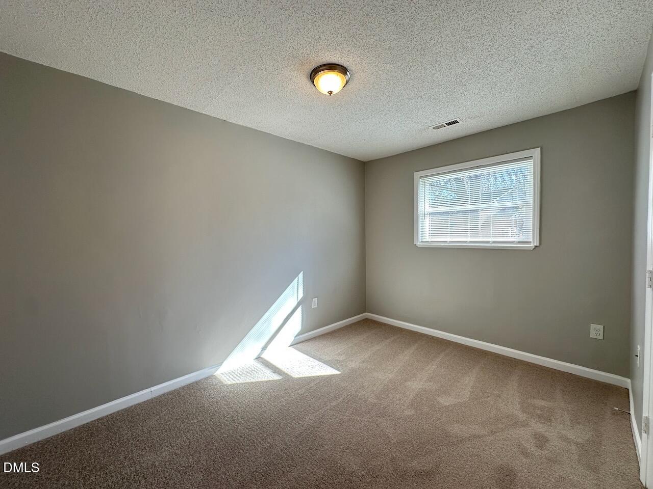 1128 Savannah Drive Raleigh, NC 27610 - Photo 13 of 21 an empty room with a window