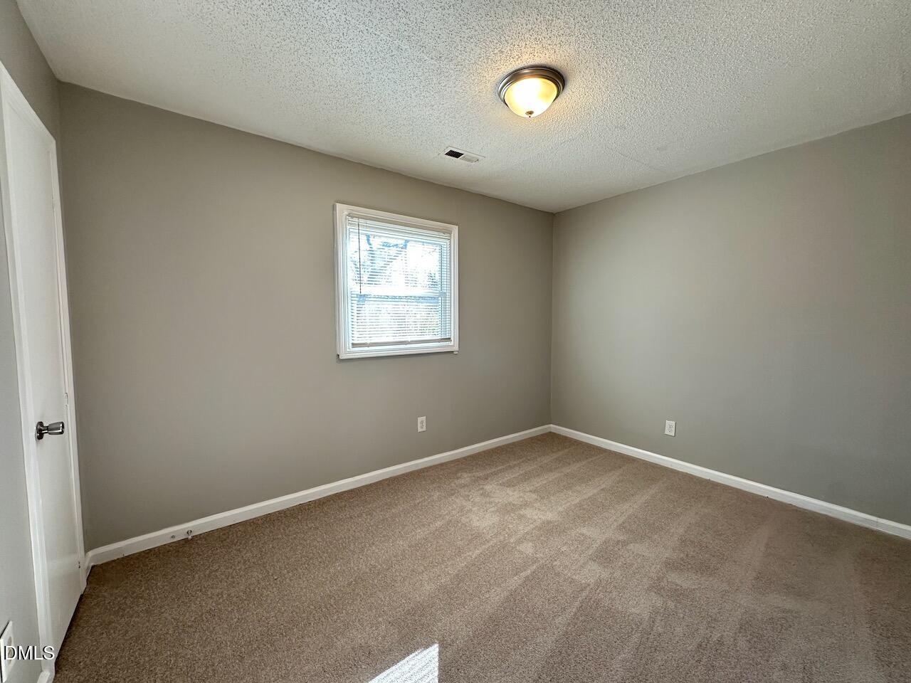 1128 Savannah Drive Raleigh, NC 27610 - Photo 15 of 21 an empty room with windows and closet