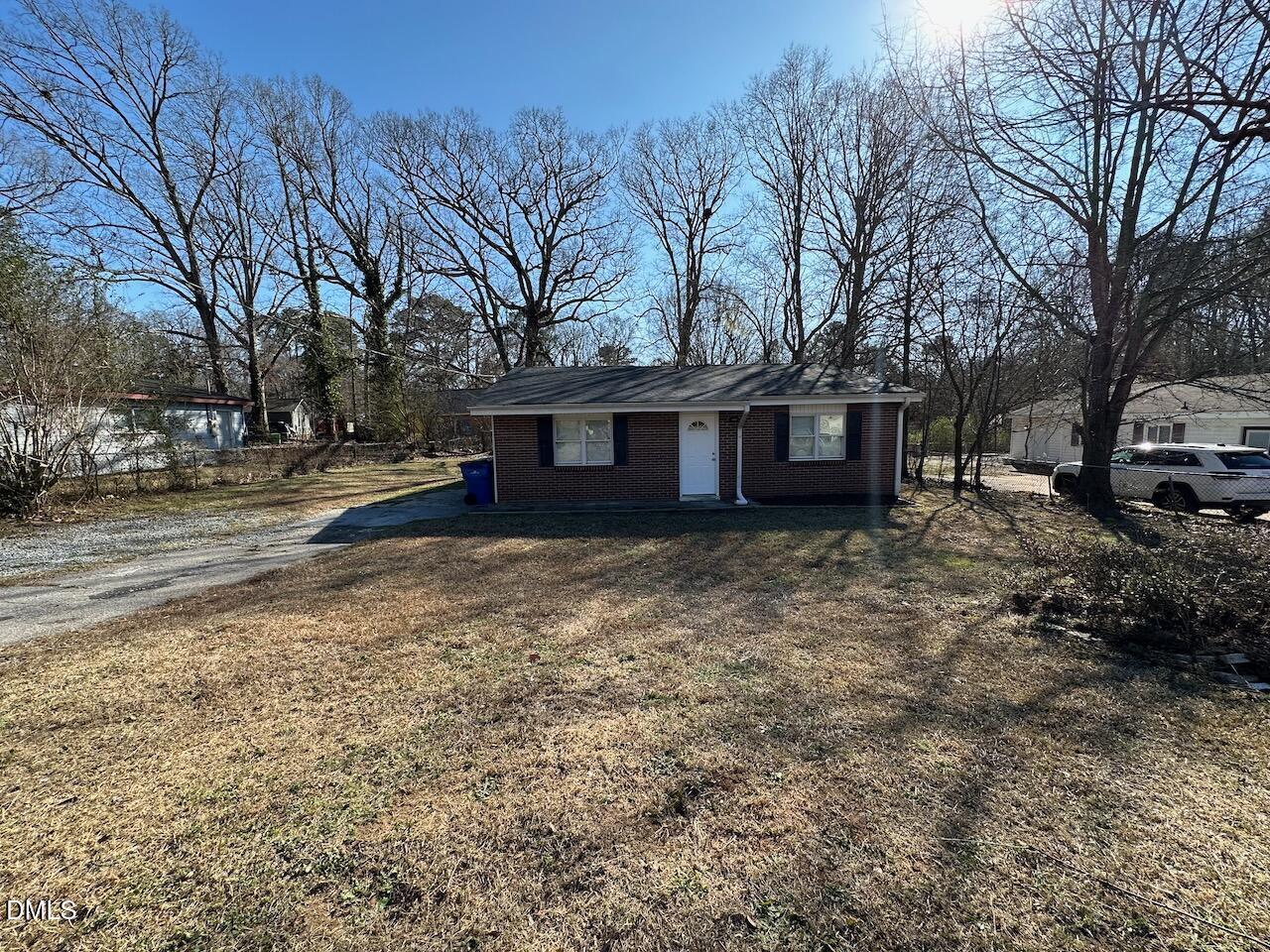 1128 Savannah Drive Raleigh, NC 27610 - Photo 2 of 21 a view of a house with a yard and large trees