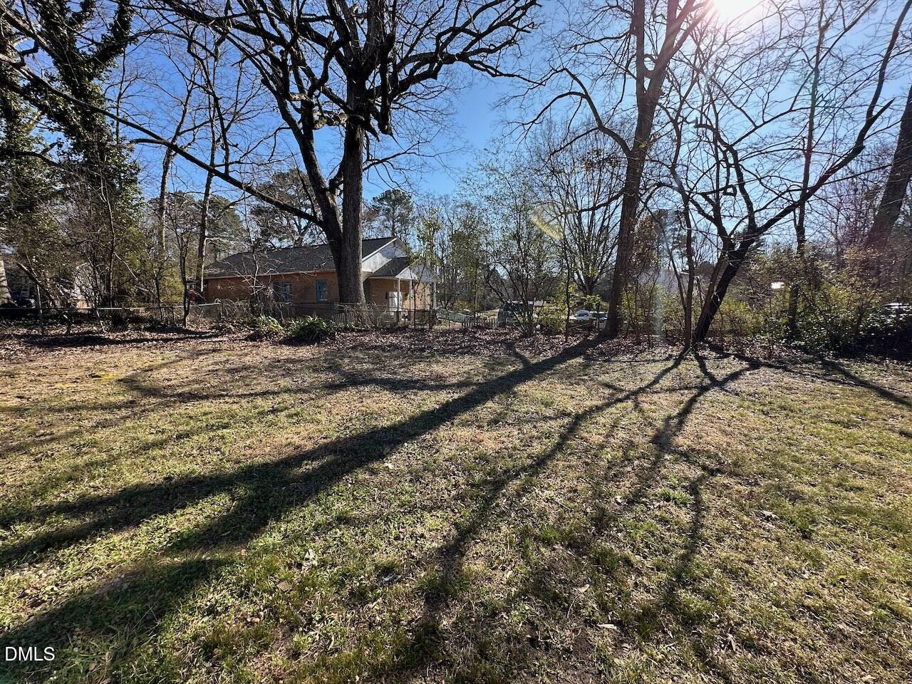 1128 Savannah Drive Raleigh, NC 27610 - Photo 21 of 21 a view of a yard with a tree