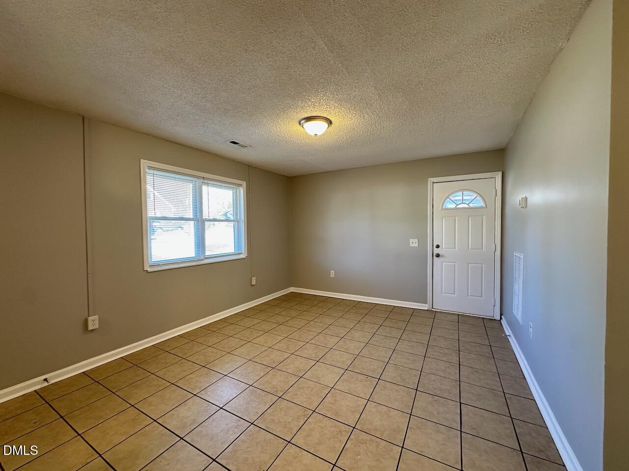 1128 Savannah Drive Raleigh, NC 27610 - Photo 7 of 21 a view of an empty room and window