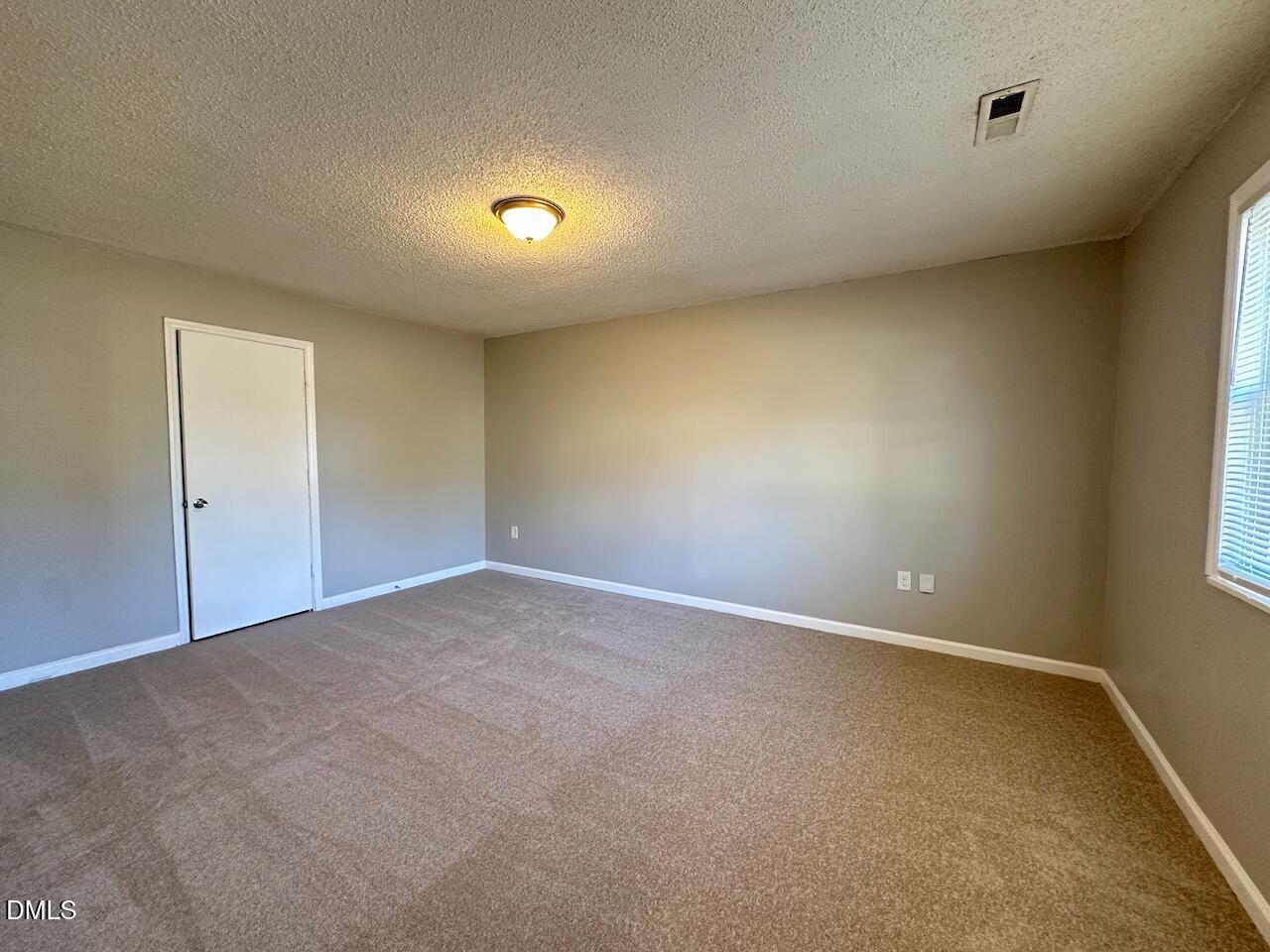1128 Savannah Drive Raleigh, NC 27610 - Photo 9 of 21 an empty room with a natural light