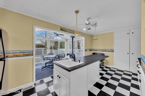 a kitchen with a sink a stove and a refrigerator
