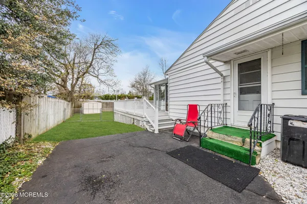 a view of a house with a yard and garage