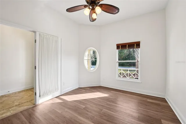 a view of a room with a large windows and plants