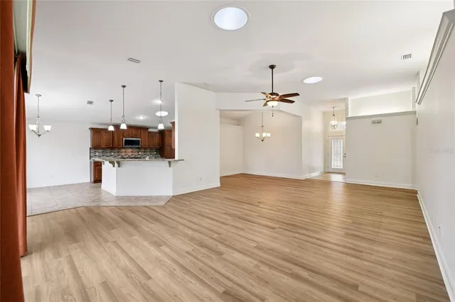 a view of a kitchen with a sink and a stove top oven
