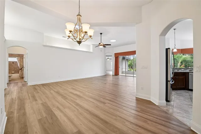a view of a chandelier with wooden floor and a chandelier