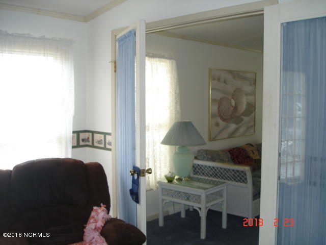 511 Leeward Way Calabash, NC 28467 - Photo 16 of 27 Double glass doors leading to den