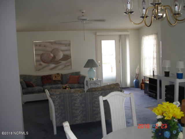 511 Leeward Way Calabash, NC 28467 - Photo 10 of 27 View from dining room into living room