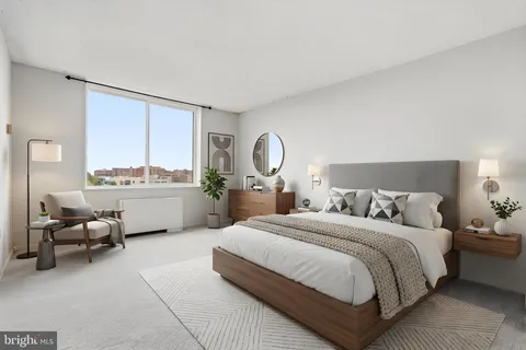 a view of an empty room and closet area