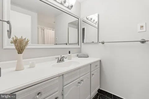 a white toilet sitting next to a bath tub and shower