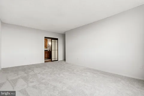 a spacious bathroom with a double vanity sink toilet and shower