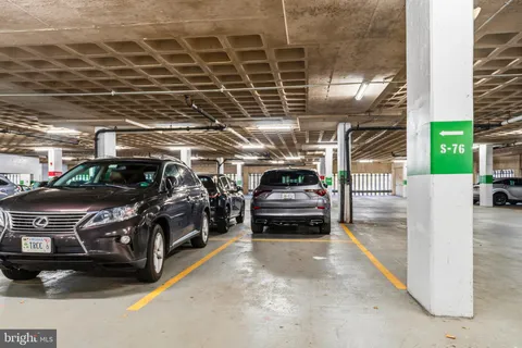 a view of parking garage with cars