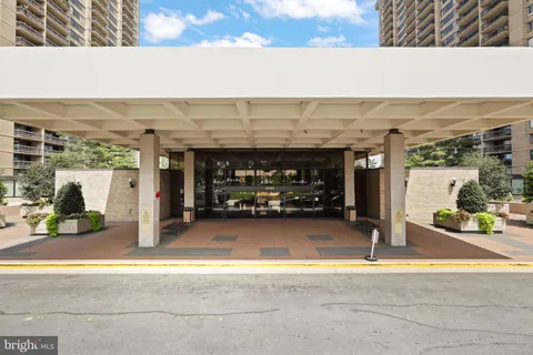 a view of a lobby with black carpet