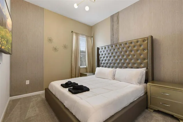 a kitchen with kitchen island granite countertop a sink refrigerator and microwave