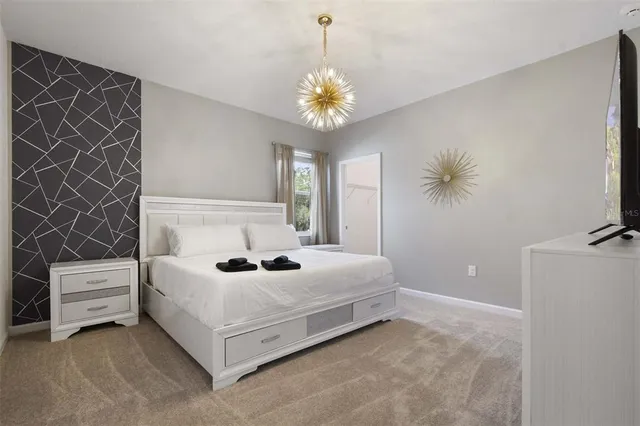 a living room with furniture and a mirror