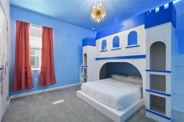a view of a a dining room with furniture window and wooden floor