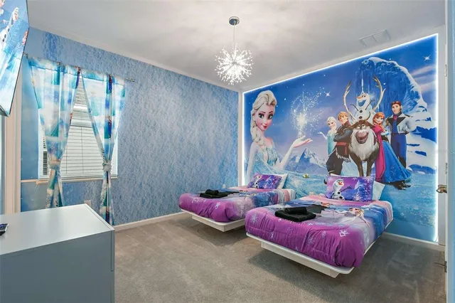 a media room with lots of chairs and a projector