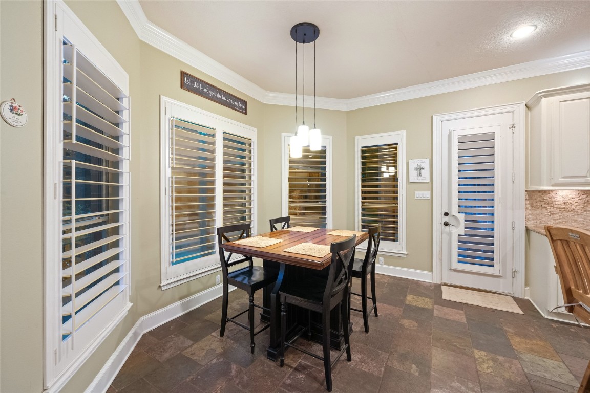 13222 Stonecrest Lane Conroe, TX 77302 - Photo 11 of 44 Breakfast table surronded with windows