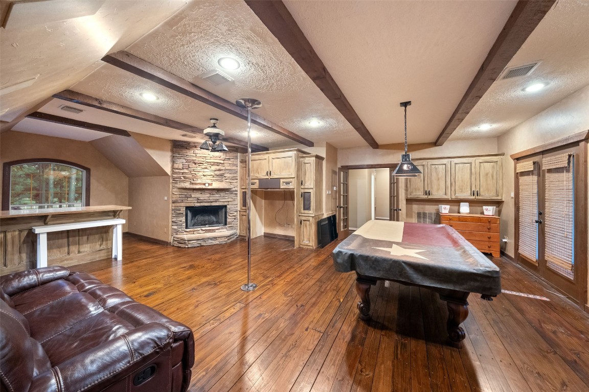 13222 Stonecrest Lane Conroe, TX 77302 - Photo 24 of 44 Gameroom has wet bar, fireplace and balcony access.