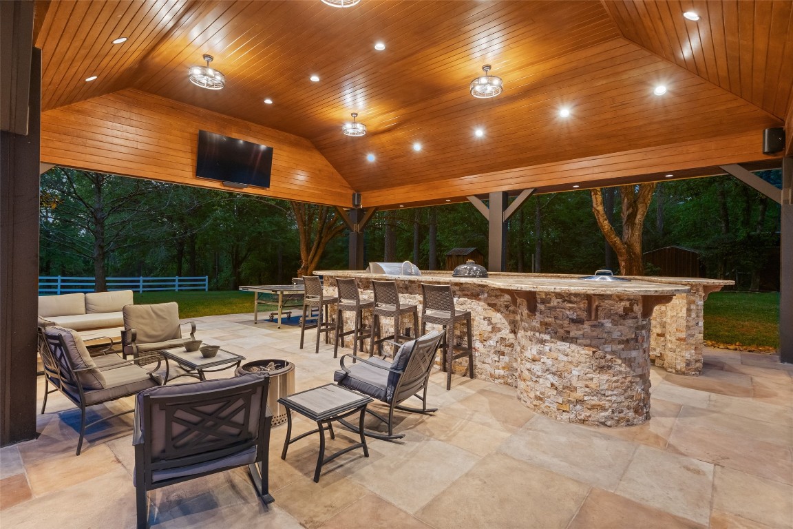 13222 Stonecrest Lane Conroe, TX 77302 - Photo 29 of 44 Covered outdoor kitchen offers many gathering options.