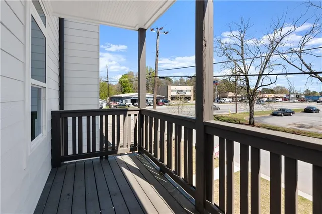 a view of a balcony with wooden floor