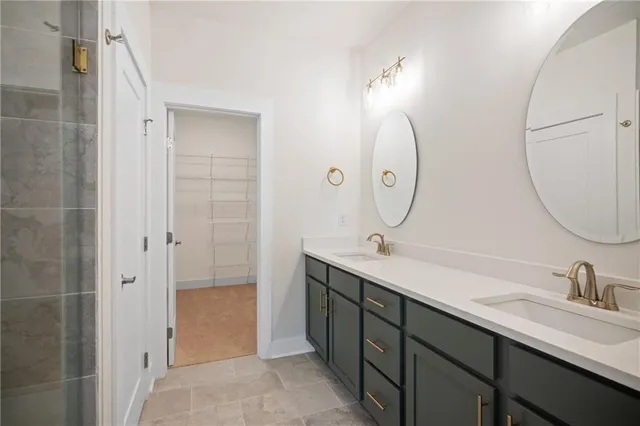 a bathroom with a double vanity sink mirror and double