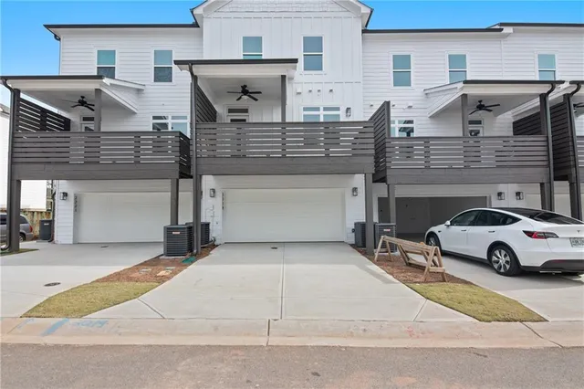 a view of a car park in front of house