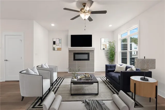 a living room with furniture and a flat screen tv