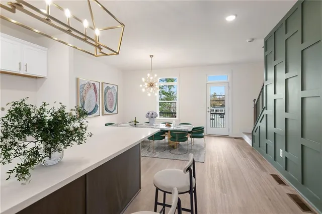 a kitchen with sink stove and cabinets