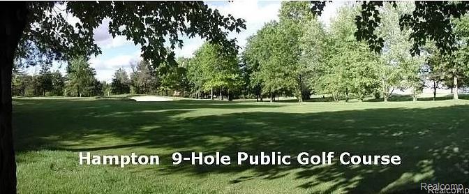 716 Eton Court Rochester, MI 48307 - Photo 27 of 41 Expansive green space featuring a golf course, mature trees, and a sand trap