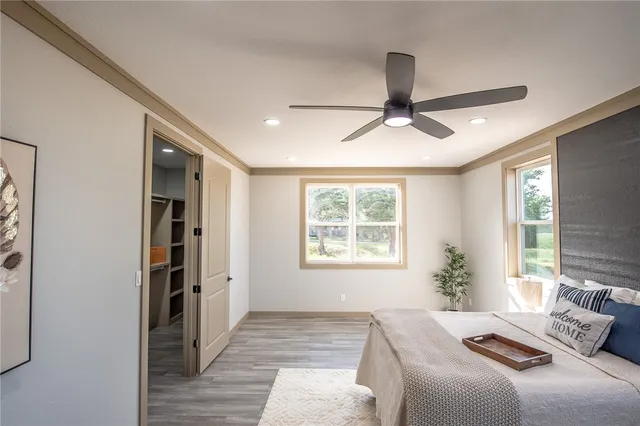 a bathroom with a toilet and a mirror