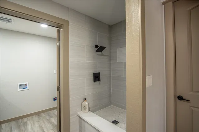 a view of a hallway with a sink