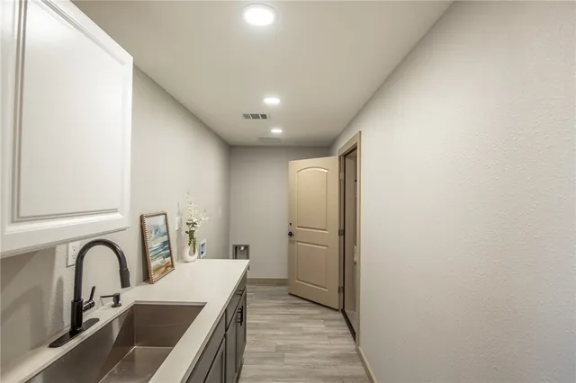 a kitchen with a stove and a microwave