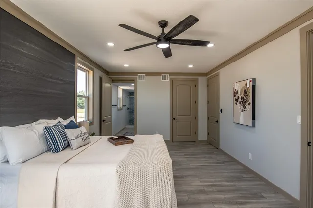 a bathroom with a double vanity sink toilet and shower